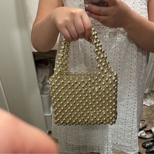 Pearl beaded bag in gold